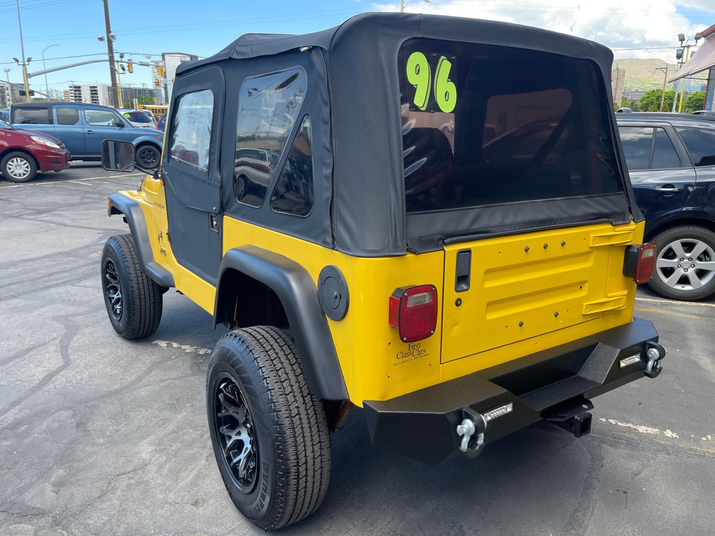 2000 Solar Yellow /Black Jeep Wrangler SE (1J4FA29P9YP) with an 2.5L 4 Cyl. engine, Manual transmission, located at 801 South State Street, Salt Lake City, UT, 84111, (801) 328-0098, 40.751953, -111.888206 - Wow extremely rare to find extra clean Jeep in immaculate condition 4x4! Low miles only 98,248 miles! Interior and exterior are both in excellent shape for the year. This is a clean title no reported accidents on the CarFax history report. It has passed emissions already and is ready to go. Featur - Photo#16